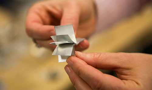 Mihaela Banu, ME Associate Professor, shows an example of an alloy in the GG Brown Building on February 20, 2014.