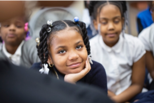 Close-up of a smiling student's face 